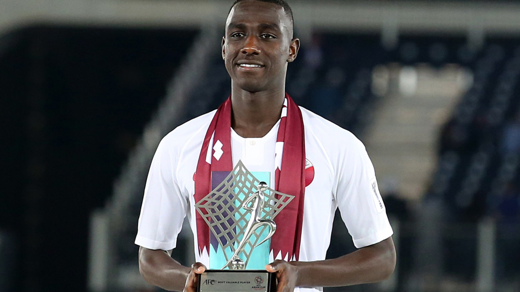  / epa07336854 Qatar's Almoez Ali poses with the trophy for most valuable player of the tournament after winning the 2019 AFC Asian Cup final match between Japan and Qatar in Abu Dhabi, United Arab Emirates, 01 February 2019. EPA/MAHMOUD KHALED