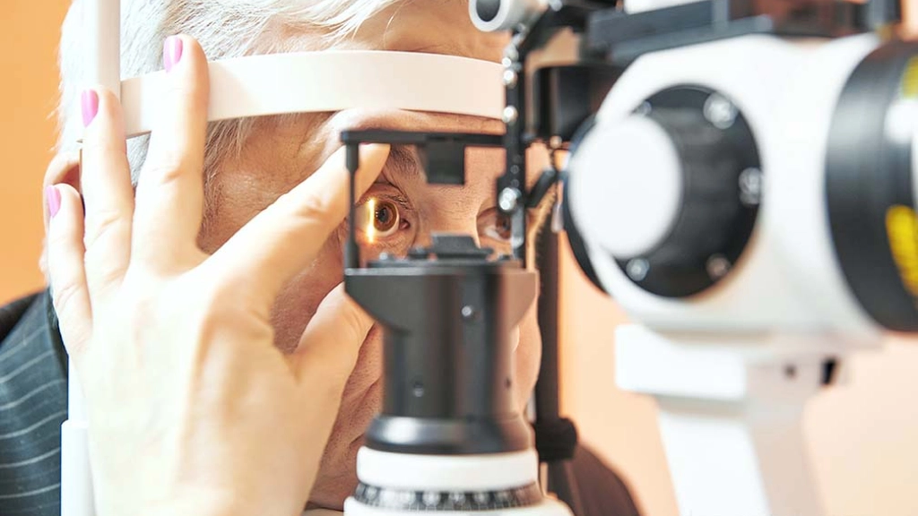 male patient under eye sight examination at ophthalmology clinic, Optometry concept. Male patient under optometrist optician examinination of eyesight in eye ophthalmological clinic