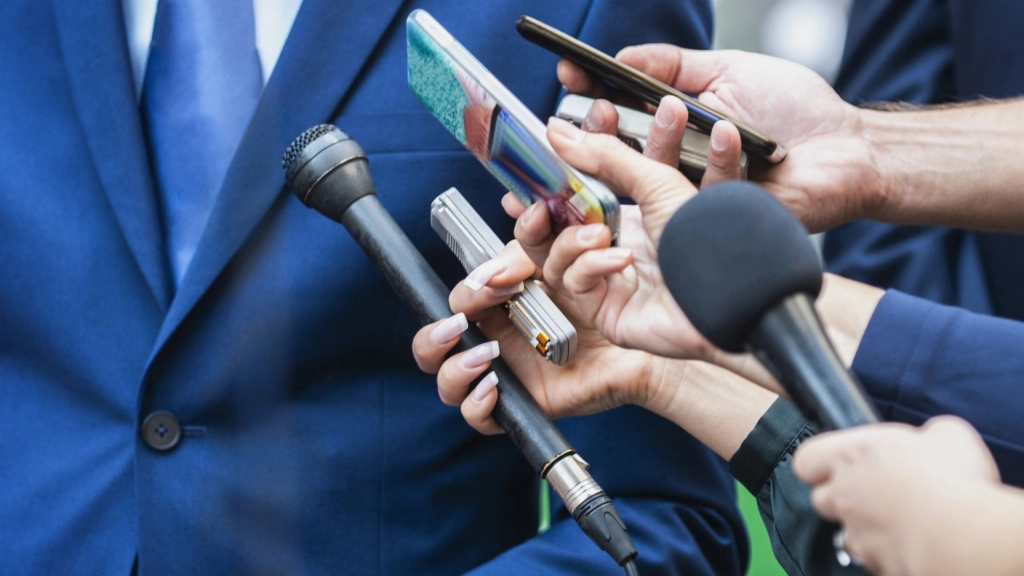 Media Interview. Journalists Interviewing Politician or Business, Media Interview - journalists with microphones interviewing formal dressed politician or businessman.